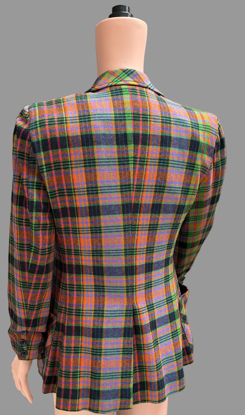 Multicolored plaid blazer on a mannequin against a plain background