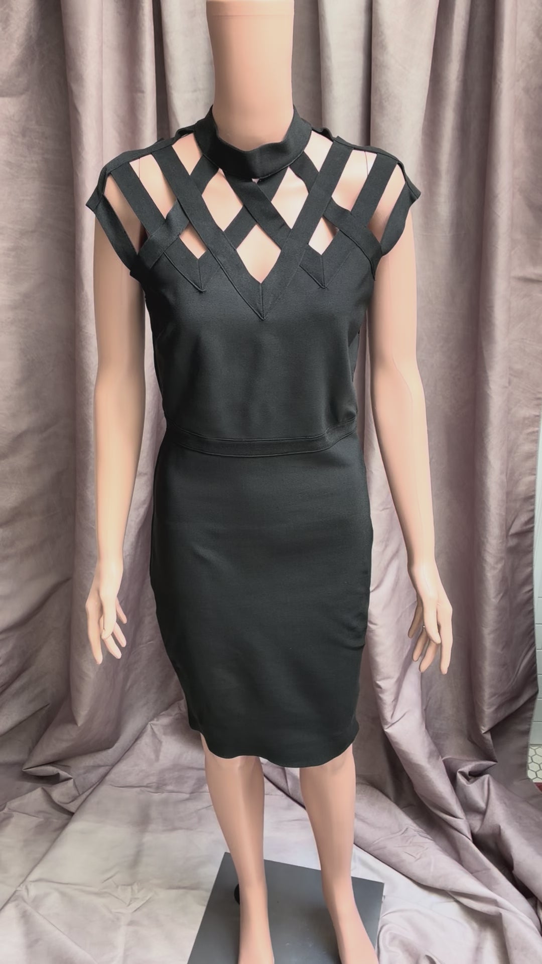 Black body con dress with caged structured shoulders